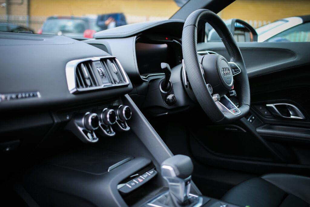 Front interior of an Audi dashboard and steering wheel